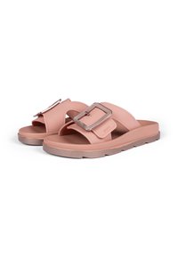 Pink slide sandals with a textured strap and a square metallic buckle accent. Soft material and chunky rubber sole.