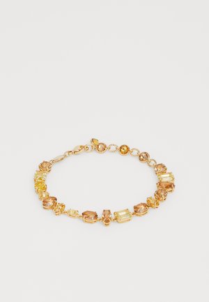 Gold-tone bracelet with yellow and amber gemstone settings in various shapes connected by small round links and a lobster clasp closure.