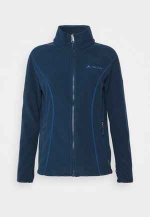 Navy fleece jacket with a full zipper, high collar, and contrasting blue stitching. Features side pockets and a small logo on the chest.