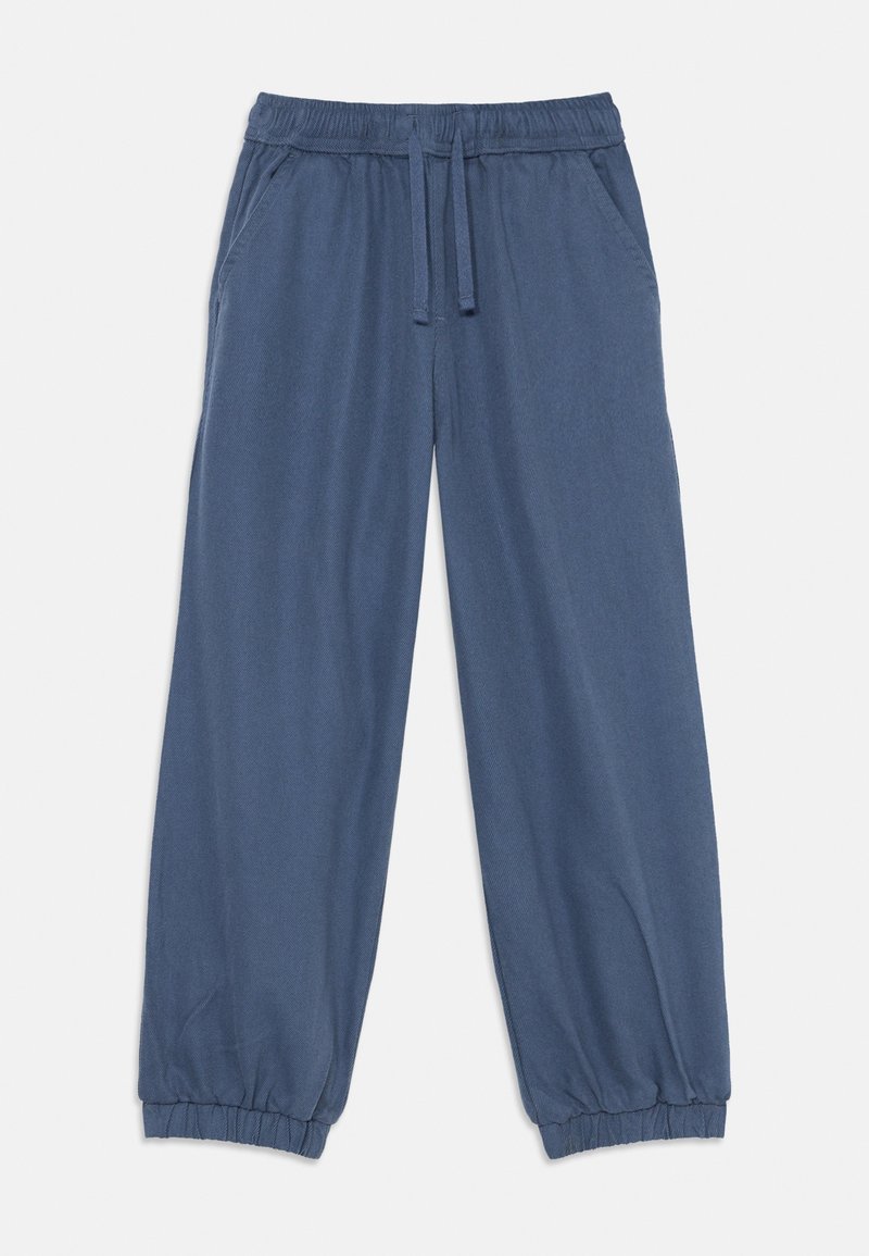 Pantalon de jogging bleu à taille élastique avec cordon, poches latérales et poignets élastiques aux chevilles sur fond blanc.