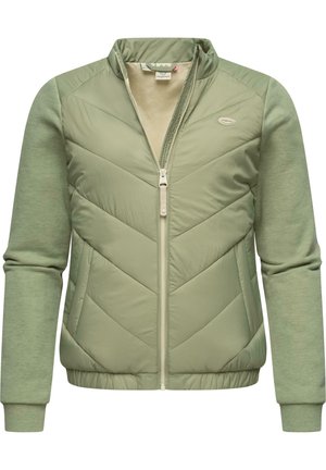 Light green zip-up jacket with chevron quilted front, soft knit sleeves, and ribbed cuffs. Features a stand-up collar and subtle logo detail.