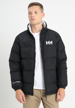 Black puffer jacket with a zip closure, quilted texture, elastic cuffs, and logo accents on the chest and sleeve. Lined hood.