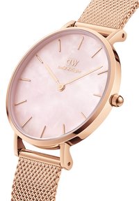 Rose gold mesh strap watch with a pink mother-of-pearl dial, slim rose gold hour markers, and a minimalist design. Features a crown on the side.