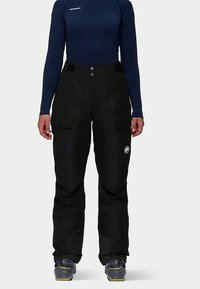 Schwarze Skihosen mit Cargo-Taschen und Logo, aus wasserabweisendem Material gefertigt. Verstellbare Taille mit zwei Knöpfen und verstärkten Säumen.