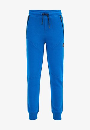 Blaue, schmal zulaufende Sweatpants mit schwarzem Kordelzug, gerippten Beinabschlüssen, seitlichen Reißverschlusstaschen und einem kleinen schwarzen Logopatch am rechten Oberschenkel.