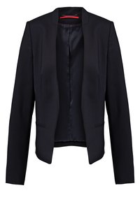 Blazer noir cintré avec manches longues, devant ouvert et doublure intérieure lisse style satin.