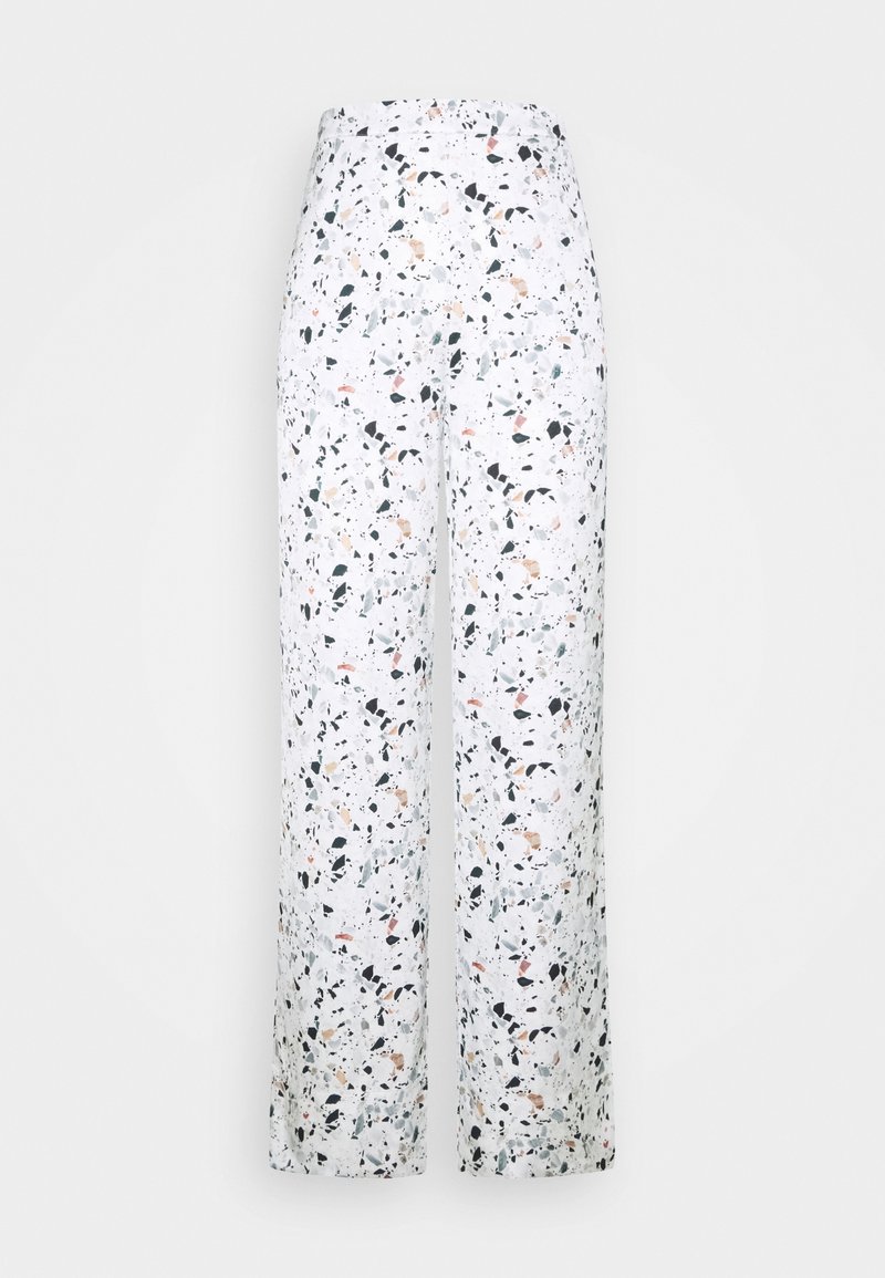 Pantalons larges en tissu blanc avec un motif terrazzo multicolore comportant des accents noirs, verts et pêche. Taille élastique, sans matériel.