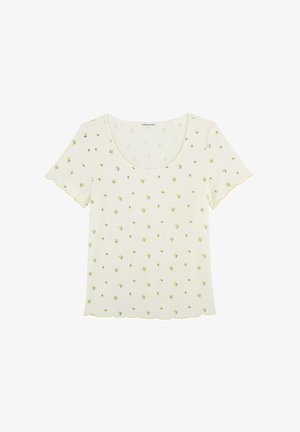 Haut court à manches courtes côtelé crème avec petit imprimé floral jaune et blanc et bords festonnés aux manches et à l'ourlet.