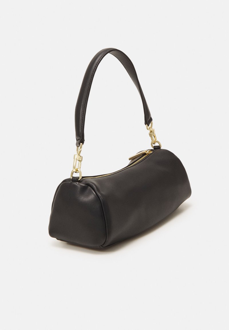 Black leather handbag with a rounded shape, featuring a gold zip closure and an adjustable strap. Smooth texture and minimal design.