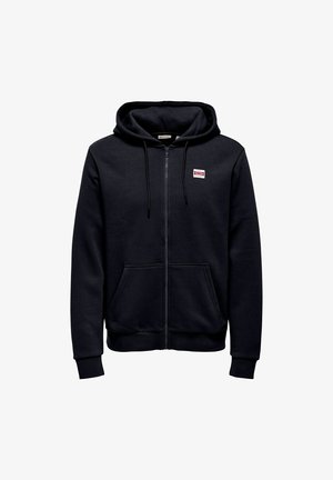Black zip-up hoodie with front pockets, drawstring hood, ribbed cuffs and hem, and small red and white logo patch on the chest.