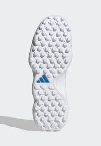 White athletic shoe outsole with textured rubber pattern, featuring round studs for traction and a blue three-stripe logo accent.