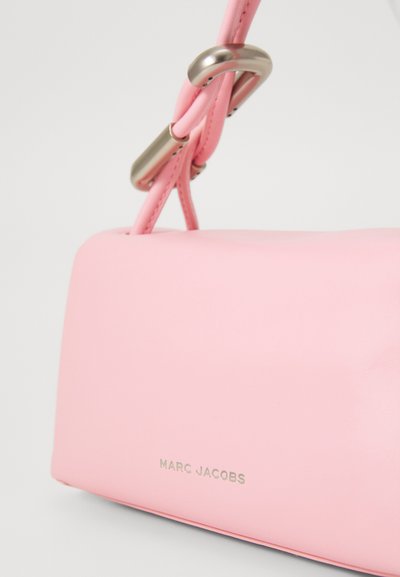 Pink leather handbag with a rectangular shape, featuring a silver metal chain and logo detail in a minimalist design.