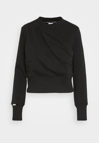 Svart kort sweatshirt i mjukt material, med en diagonalt vriden design fram, ribbade ärmslut och rundad halsringning.