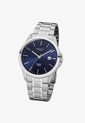 Montre-bracelet en métal argenté avec cadran bleu foncé, index argentés, affichage de la date à 3 heures, et trois aiguilles argentées indiquant 10:09:21.