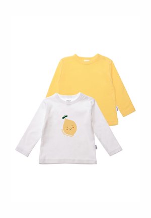Two long-sleeve children's shirts: one yellow, one white with a lemon graphic and "Squeeze the Day" text. Cotton material, soft texture.