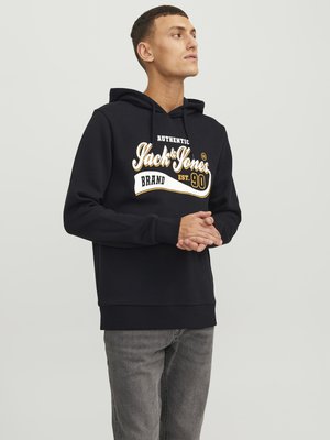 Black hoodie made of cotton with a front graphic in white and gold text. Features a drawstring hood and ribbed cuffs and hem.