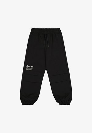 Pantalones de chándal negros hechos de un tejido suave, con cintura elástica, cordón y un sutil logo en blanco en el muslo izquierdo.
