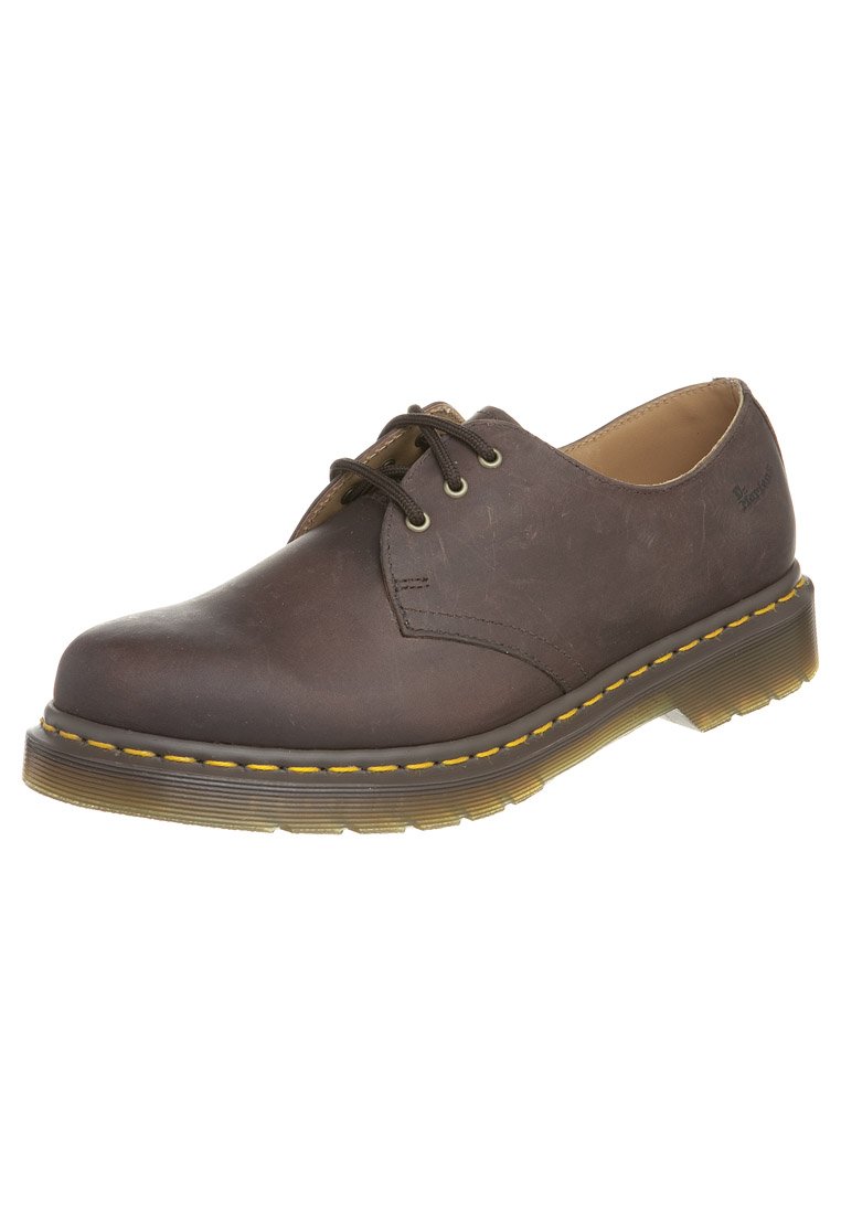 Brown leather lace-up shoes with a rounded toe, textured upper, yellow stitching, and a thick, translucent rubber sole.