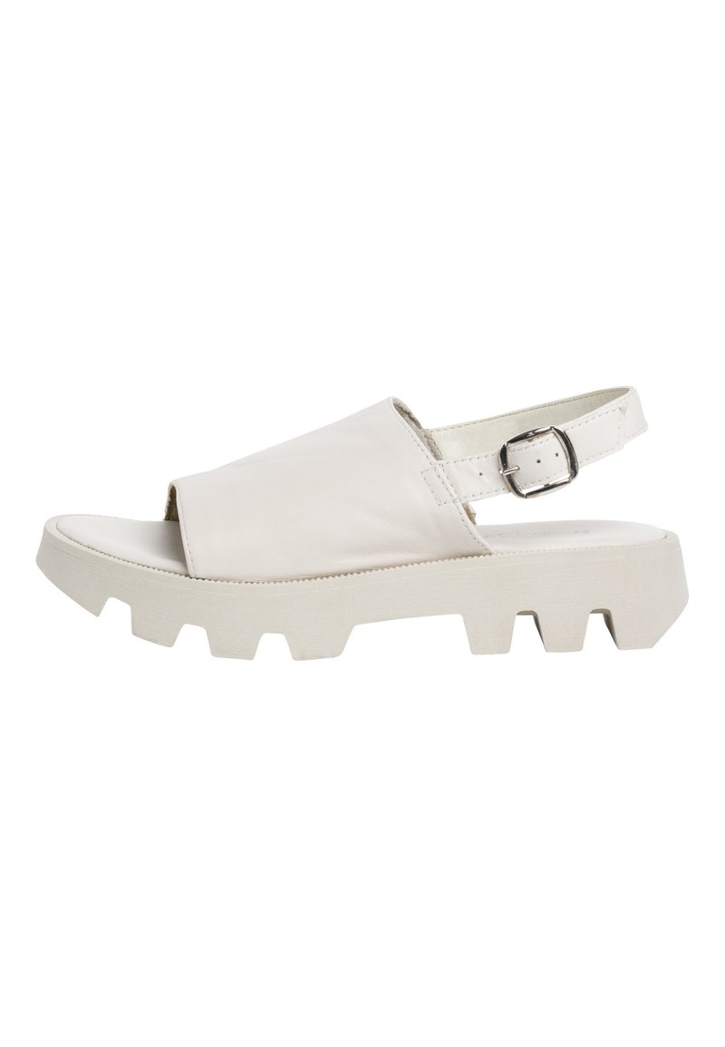 White leather sandal with a wide front strap, open toe, adjustable ankle strap, and chunky white rubber outsole with a textured pattern.