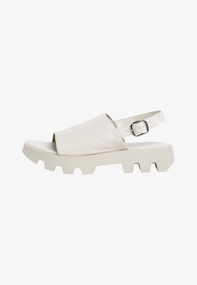 White leather sandal with a wide front strap, open toe, adjustable ankle strap, and chunky white rubber outsole with a textured pattern.