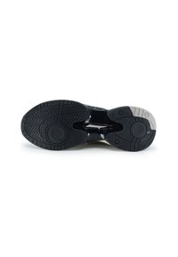 Schuhsohle mit einer schwarzen strukturierten Gummibeschichtung, die über runde Griffe und einen kontrastierenden grauen Akzent nahe der Ferse verfügt.