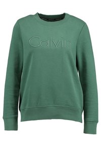 Zelená bavlněná mikina s žebrovanými manžetami a lemem. Má vyšívané logo "Calvin" na hrudi. Klasický kulatý výstřih.