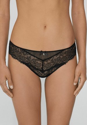 Schwarze Spitzenunterwäsche mit aufwendigen floralen Mustern, einem transparenten Design und einer kleinen Satinschleife an der Vorderseite. Sanfter Stoff und detaillierte Kanten.