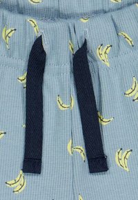 Modré žebrované šortky se žlutým potiskem banánů, s tkaničkou z tmavě námořnické látky a uvolněným designem pasu.