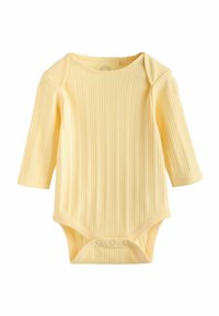 Kollane soonikkoega pikkade varrukatega bodi pehmest kangast. Alumises osas on mugavaks riietumiseks trukkidena sulguri detailid. Tekstuuriga pind.