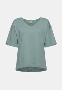 T-shirt femme bleu clair à manches courtes, col en V, coupe ample, épaules tombantes et ourlet légèrement arrondi.