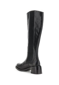 Svart läder knä-high stövlar med rund tå, chunky klack och elastiska sidopaneler för en smidig passform. Slät textur och minimala designdetaljer.