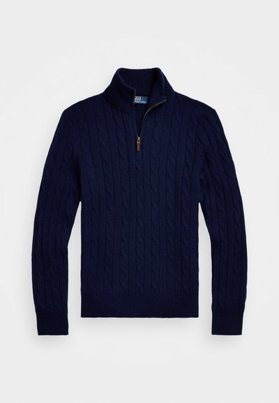 Suéter de punto trenzado en azul marino con cuello de cremallera, que cuenta con puños y dobladillo acanalados. Fabricado con hilo texturizado para un aspecto acogedor.