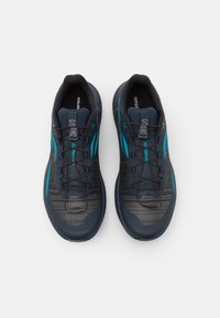 Salomon GENESIS - Scarpe da trail running - carbon/tahitian tide/quiet shade