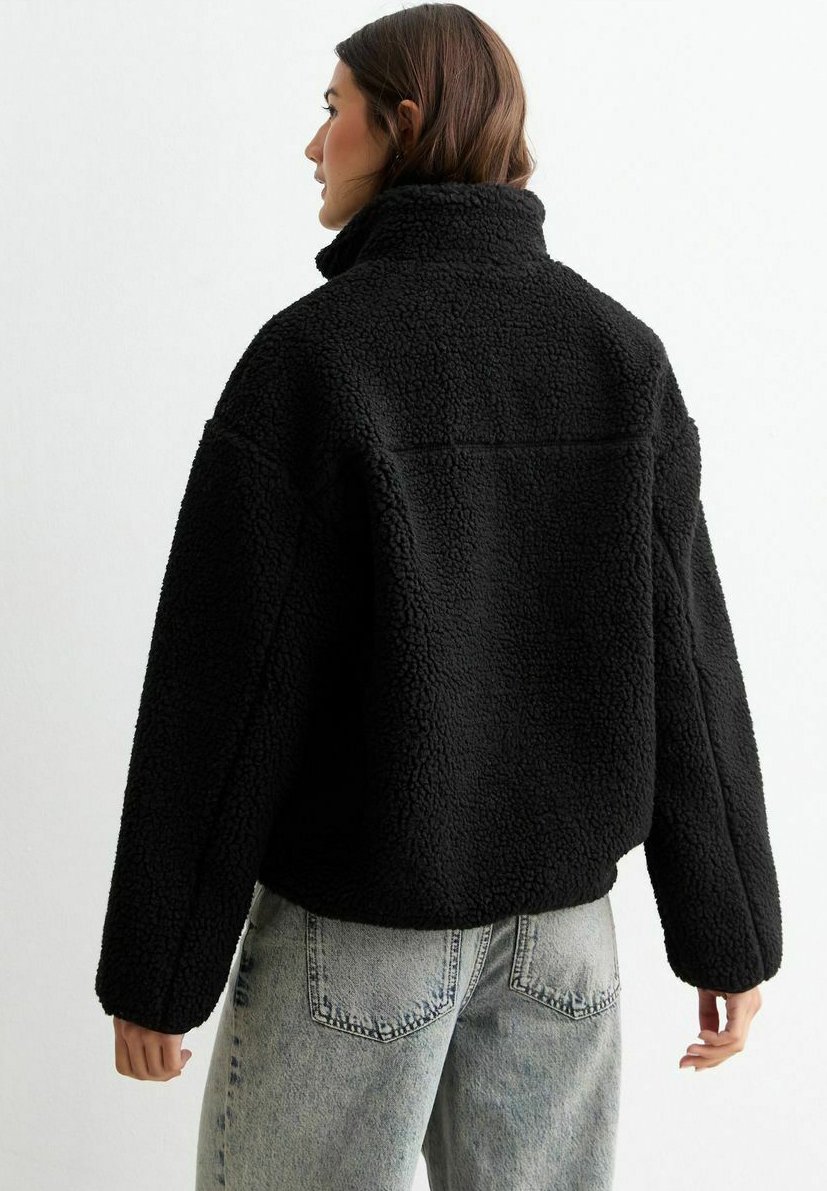 asos nike cropped borg fleece in black