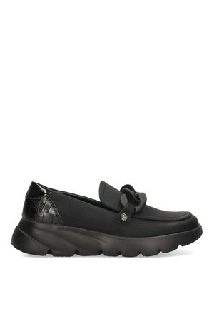 Zapatos negros de tipo slip-on con parte superior de cuero liso y un tacón texturizado con patrón de cocodrilo brillante. Cuentan con una suela de goma y un detalle decorativo de nudo.