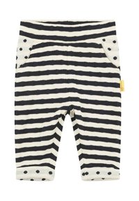 Striped pants in cream and navy with polka dot accents on pockets and cuffs, featuring a soft fabric and elastic waistband.