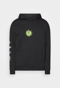 Hoodie nera con un motivo grafico centrale verde che ricorda un cuore. Include una tasca frontale e dettagli stampati sulle maniche.