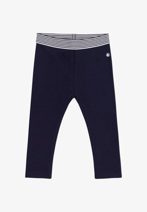 Leggings navy con vita elastica a righe. Materiale morbido, design aderente, si estende fino alla caviglia. Presenta un piccolo logo sulla vita.
