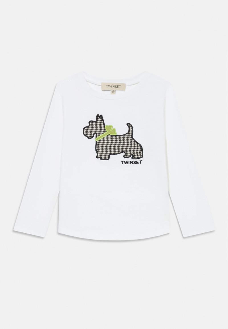 Witte lange mouwen t-shirt met een zwart-wit geblokt Schotse hondontwerp en een groene strikaccent. Etiket leest "TWINSET."