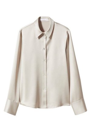 Koszula w kremowym kolorze z długim rękawem, zapinana na guziki, z ostro zakończonym kołnierzykiem i szerokimi mankietami, przedstawiona na białym tle.