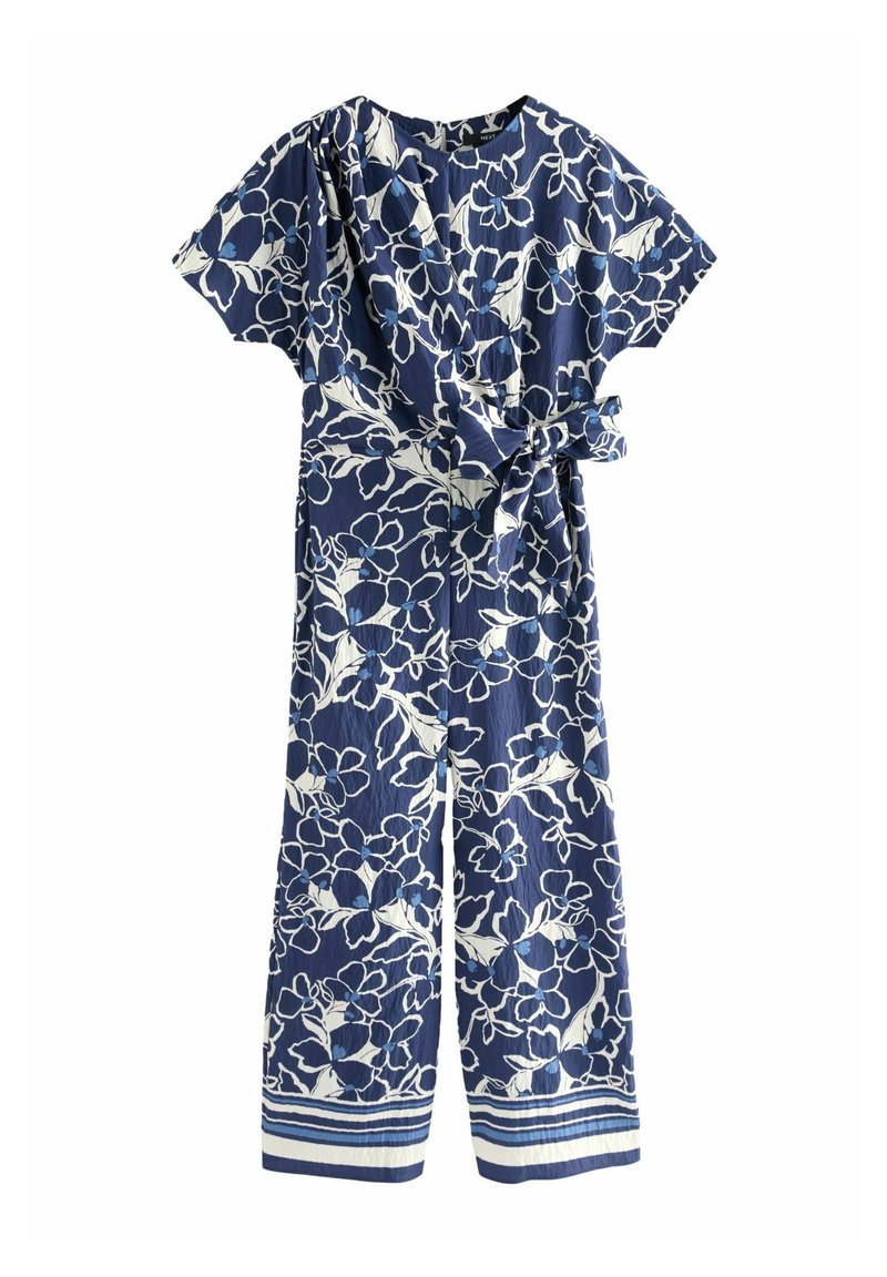 Navy blauwe jumpsuit met wit bloemenpatroon. Korte mouwen, wikkelontwerp en strik taille. Gestreepte accenten aan de zoom. Lichtgewicht stof.