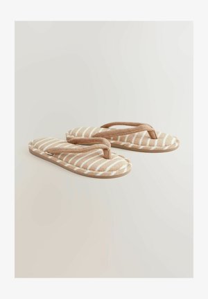 Svītraini beiga čības ar mīkstu auduma augšdaļu un kontrastējošām baltām svītrām. Flip-flop tipa dizains ar mīkstinātu siksnu un teksturētu zoli.