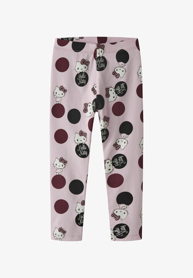 Roze legging met een herhalend Hello Kitty-patroon, verfraaid met zwarte en kastanjebruine cirkels en tekstdetails in een speelse lettertype.
