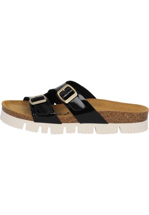 Schwarze Lacksandalen mit zwei verstellbaren Riemen und Metall-Schnallen. Korkfußbett und weiße strukturierte Außensohle mit geriffeltem Muster.
