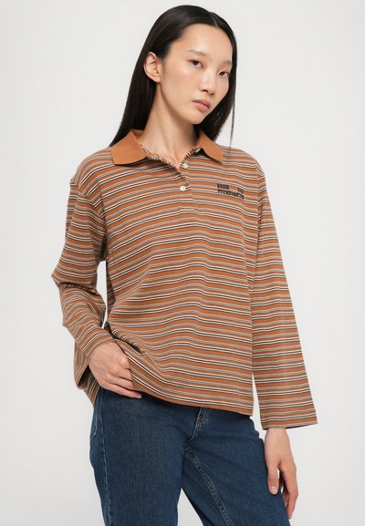 Brown striped long-sleeve polo shirt with a buttoned collar and white accents. Features a logo on the left chest and relaxed fit.