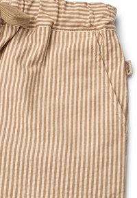Tissu en coton rayé beige et crème avec une taille élastique, comportant une poche latérale et une petite étiquette sur la couture.