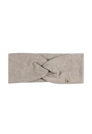 Strickhaarband in einem hellbeigen Farbton mit einem gedrehten Design an der Vorderseite und einem kleinen Markenetikett an der Seite. Glatte Textur.