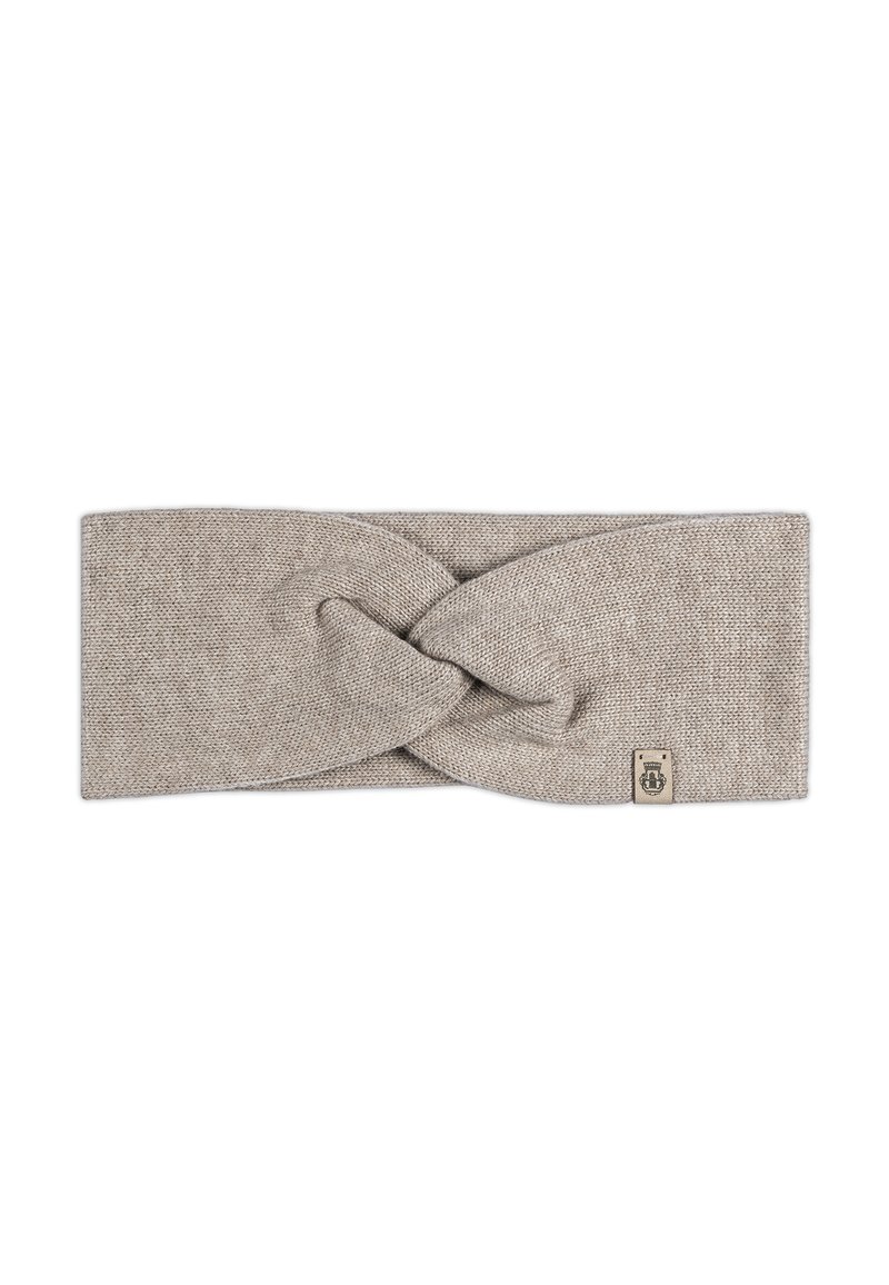 Knit headband in a light beige color with a twisted design at the front and a small branded tag on the side. Smooth texture.