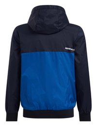 Huppari, jossa on tummansininen yläosa ja kirkas sininen alaosa. Valmistettu sileästä, kevyestä materiaalista, jossa on joustavat hihansuut.