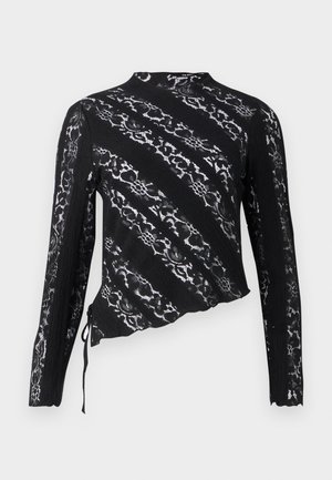 Black lace long-sleeve top with asymmetrical design, features intricate patterns, textured fabric, and adjustable side tie detail.